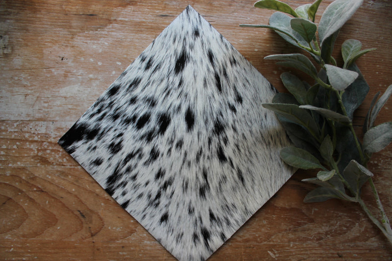Black and white speckled cowhide grad cap topper