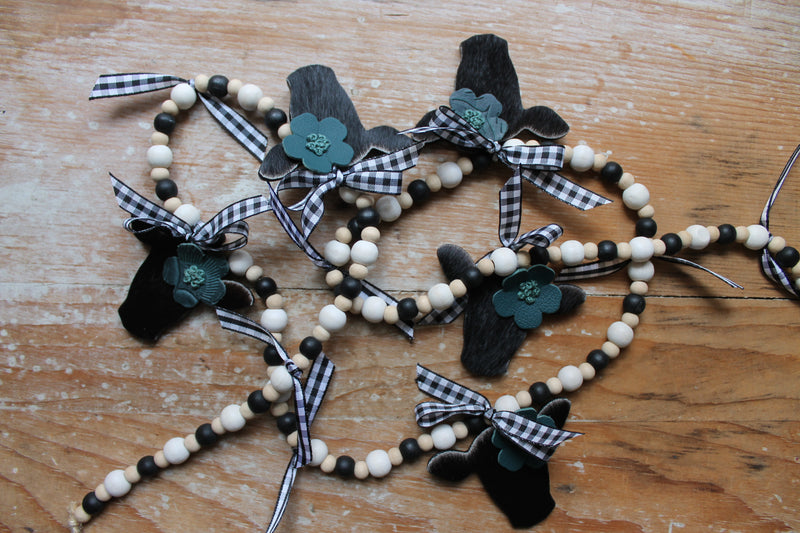 Mini Black Heifer Head Garland with Teal Flowers