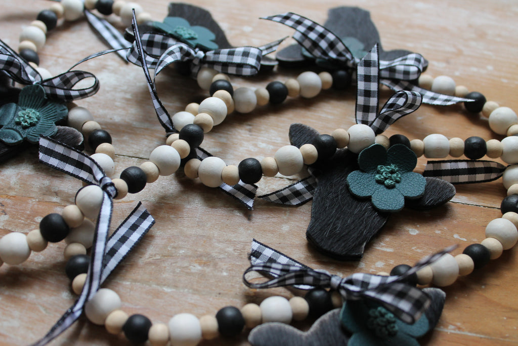 Mini Black Heifer Head Garland with Teal Flowers