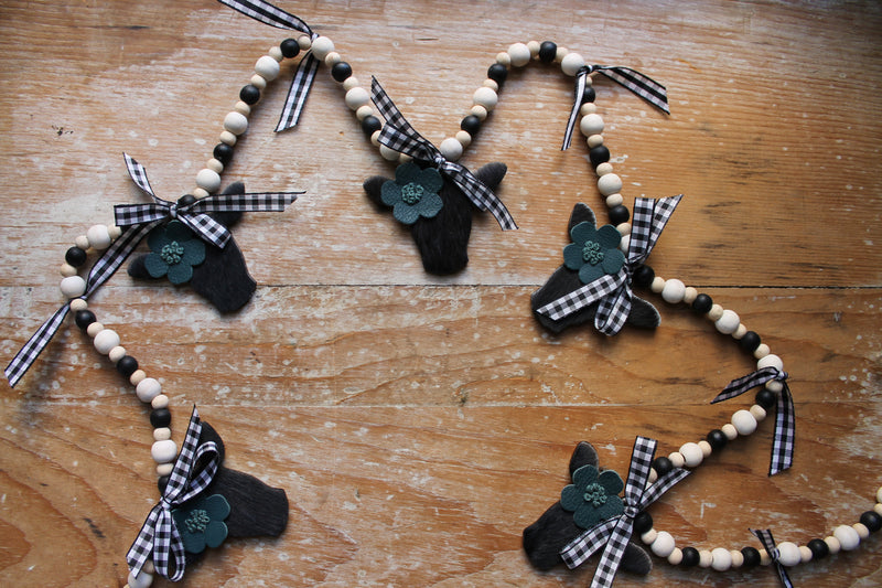 Mini Black Heifer Head Garland with Teal Flowers